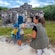 A guide and a child exploring ancient Mayan ruins at Punta Sur Eco Park in Cozumel, Mexico